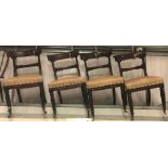 Set of four William IV mahogany dining chairs with stiff leaf carved mid rail over an upholstered