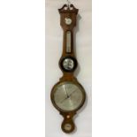 Mahogany inlaid banjo barometer with four silvered dials, the case with inset convex mirror and swan