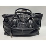 A Tods black leather white stitch handbag, with interior zipped pocket, black cotton interior,