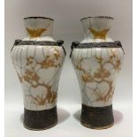 A pair of 20th Century Chinese crackle glazed vases painted in yellow enamel with a blossoming