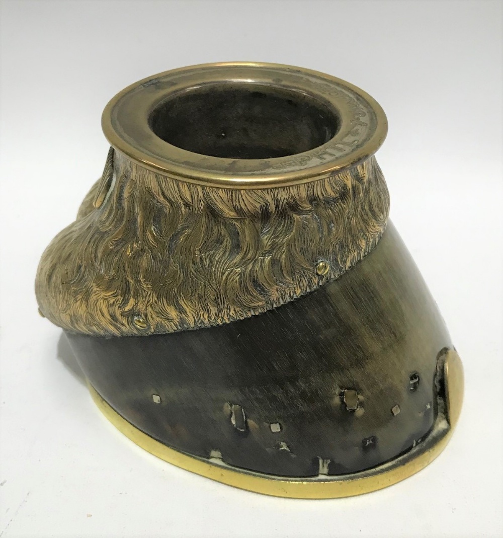 An early 20th century brass mounted horse hoof ashtray, the rim inscribed 'Phil 7 Jan 1913', with