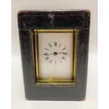 A brass cased carriage clock, the 2.5 inch white enamel dial with black Roman numerals and signed '