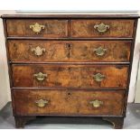 18th Century walnut veneered chest of two short over three long graduated drawers, the feather