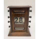 A Victorian oak three section perpetual calendar, height 14cm.