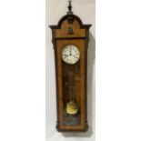 A two-train Vienna wall clock with burr walnut veneered case, the 6in white enamel dial with Roman