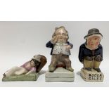 A Victorian Staffordshire pottery figure of a portly seated gentleman, height 14cm; together with