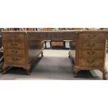 A good 20th Century George II style walnut veneered inverted break front twin pedestal partners