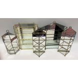 Five glass mirrored and metal framed terrariums.