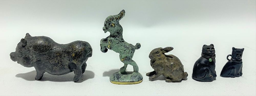 Bronze patinated miniature rearing goat, height 4.5cm; together with a bronze model of a pot-bellied