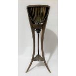 19th Century style mahogany plant stand with brass liner and raised on three tapering outswept