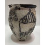 Studio Pottery Raku vase with stylised decoration of figures, a building and car, height 18cm.