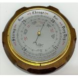 An aneroid barometer within mahogany case, with 8 inch silvered dial, signed 'Shortland Smiths'.