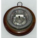 A walnut cased aneroid barometer, diameter 18cm
