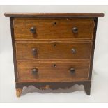 19th Century small apprentice chest of three drawers upon outswept feet over a shaped apron and on