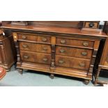 A 19th Century French walnut sideboard with an arrangement of six drawers and raised on five