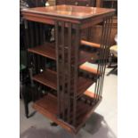 Early 20th Century walnut four-tier revolving bookcase, height 118cm x width 57cm