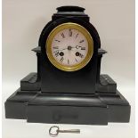 A black marble cased two train mantle clock, the 3.5 inch white enamel dial with black roman
