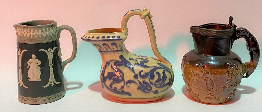 19th Century sprigged stoneware hunting jug with greyhound handle, height 16cm; together with a