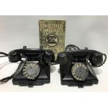 Two Bakelite dial telephones with trays under, one marked to the base 'FWR 51/2 1/232F' and with a