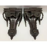 Pair of Neo Classical style mahogany wall hanging brackets, the rectangular break front top with