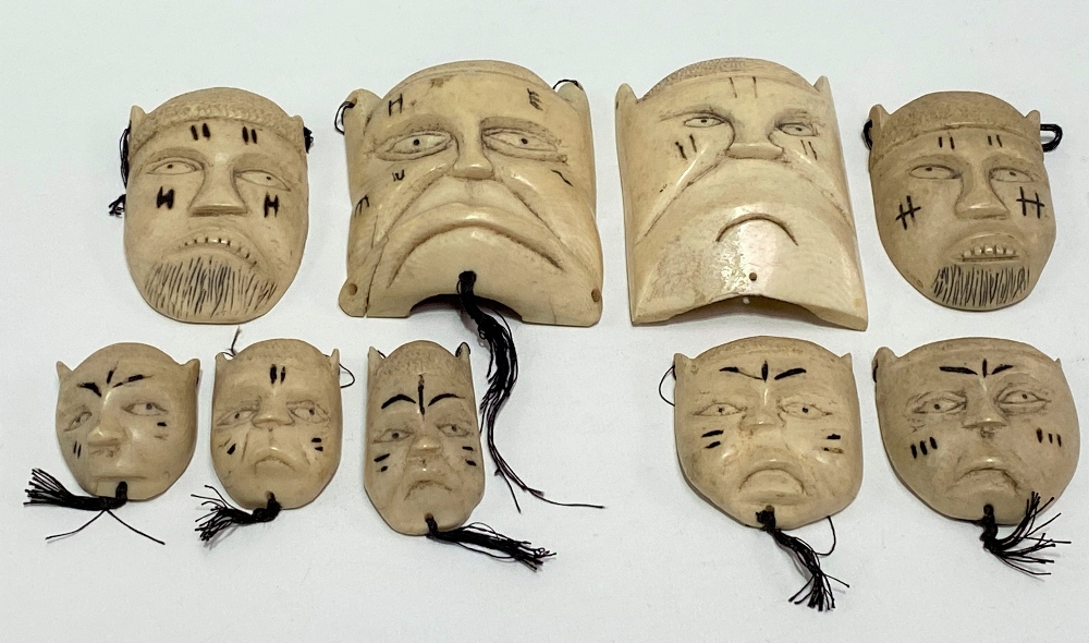 Nine early 20th Century African carved ivory tribal masks, the largest height 9cm