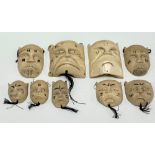 Nine early 20th Century African carved ivory tribal masks, the largest height 9cm
