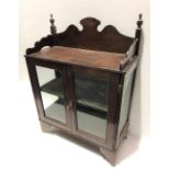 An early 20th Century mahogany small glazed display cabinet, height 65cm