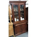 Victorian mahogany glazed bookcase, the arched glazed doors enclosing two adjustable shelves, the