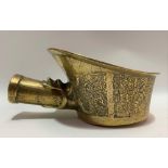Chinese brass iron with archaic cast design, width 20.5cm