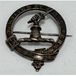 A Scottish white metal clan badge with the motto 'Fortiter et Fideliter', stamped to the back R &