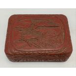 Chinese cinnabar lacquer rectangular box, the lid carved with a reserve of a flying duck over