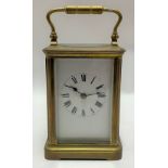 French brass cased carriage clock, the 2.5in white enamel dial with black Roman Numerals, the