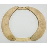 Interesting hippo tusk frame, carved with two mythical winged creatures and foliage, width 24cm