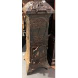 A 19th Century French cast iron stove cast with foliate scrolls and maker's mark CH, height 98cm