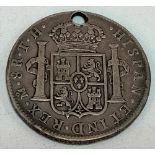 Mexican 8 Reales 1806 coin, with drilled hole.