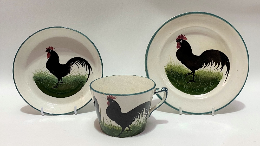 A Wemyss ware black cockerel decorated trio impressed and printed marks and retailed for T. - Image 2 of 2