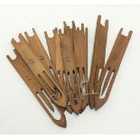 Twelve wooden net mending needles