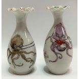A pair of Japanese porcelain small flared neck vases with frilled rims, decorated with enamels