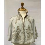A Victorian ladies dove grey felt shoulder cape, with gold thread embroidery and cream silk
