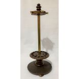 A good early 20th Century mahogany and brass revolving pedestal snooker cue stand upon circular base