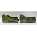 Pair of Chinese childs silk slippers with embroidered decoration on a lime green ground, length