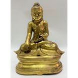 A Chinese gilt bronze figure of Shakyamuni Buddha seated in Vajrasana, height 21.5cm