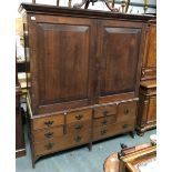 George III and later oak hall cupboard, the top with moulded cornice over a pair of fielded panel