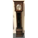 An oak three-train grandmother clock with 5.5in silvered dial with Arabic Numerals, the hood with