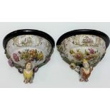 Pair of German porcelain flower encrusted wall brackets, foliate painted and with courting couple