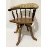 Early 20th Century mahogany swivel desk chair with leather button-back rail over eight baluster