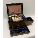 A Victorian burr walnut ladies vanity box, the hinged lid with brass inset shield and ribbon