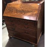 A 19th Century mahogany bureau, the fall front hinged to reveal a fitted interior over two short