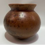 African Zulu earthenware ovoid pot with woven grass stand, diameter 22cm