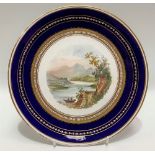 19th Century porcelain cabinet plate, the well painted with a mountainous lake landscape within gilt